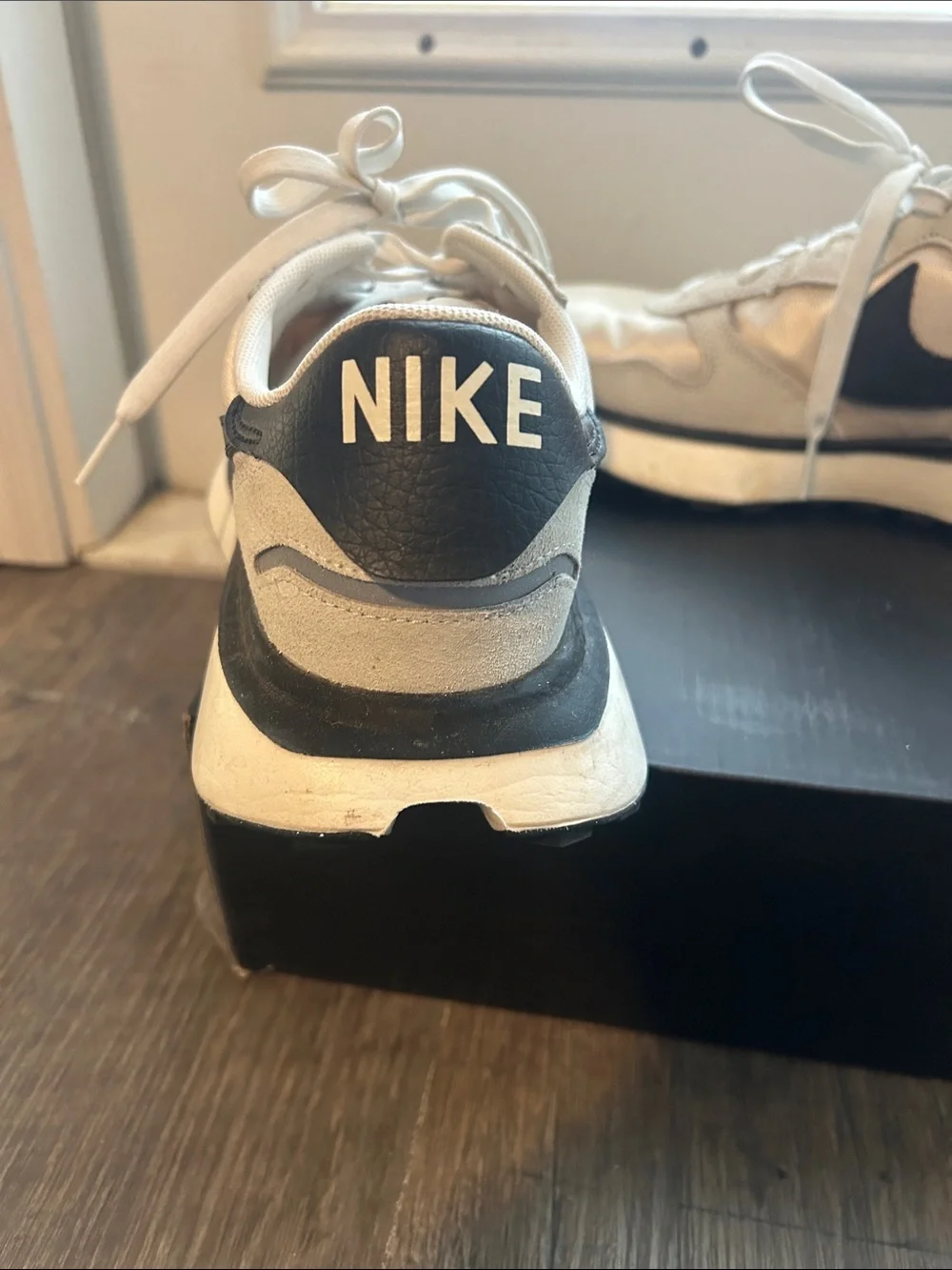 Women’s Nike Cream and Black Swoosh Platform Running Sneakers